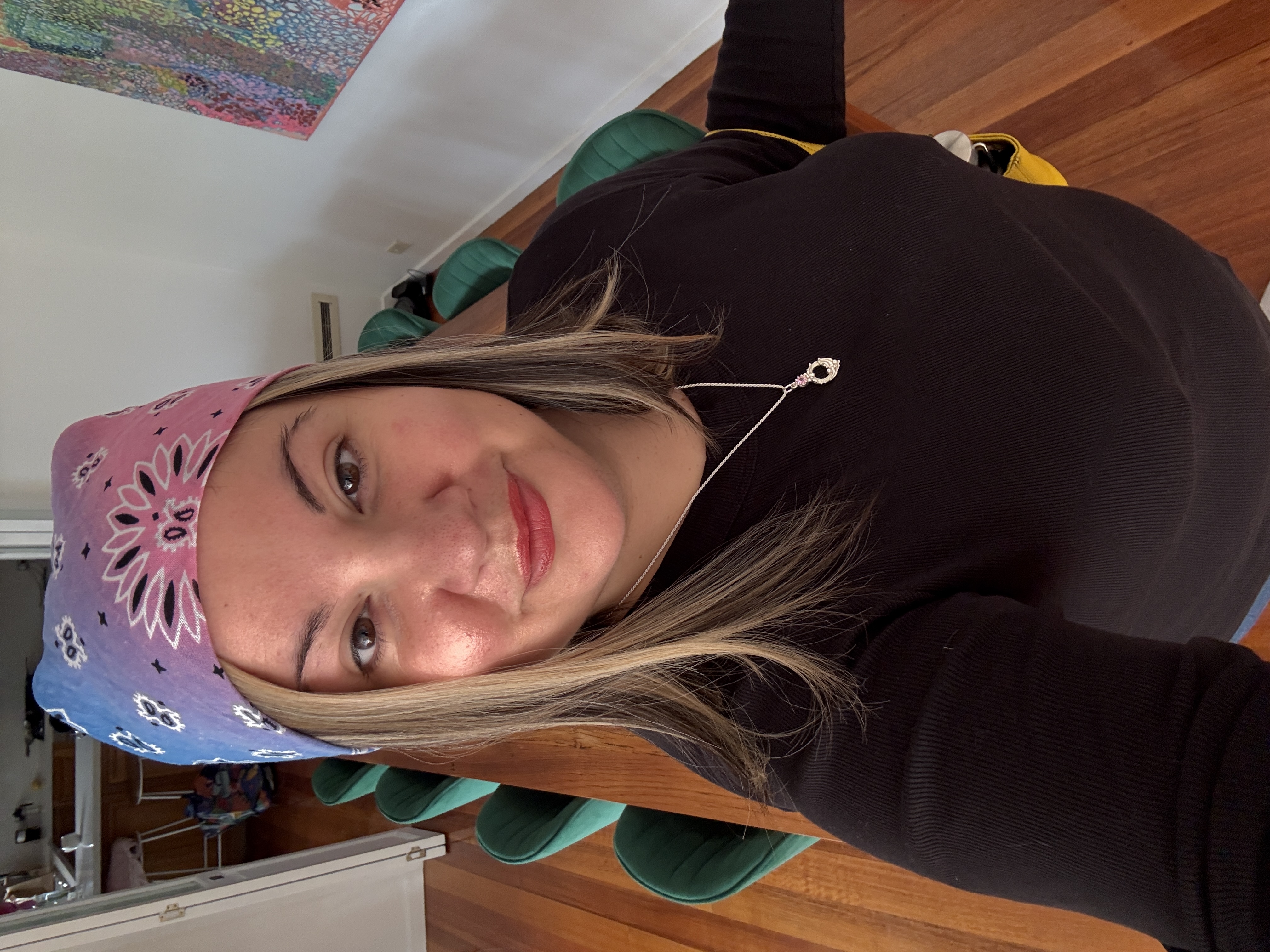 A selfie photo of Dahna in a hot pink dress.